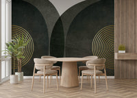Modern Mid Century Charcoal Gold wallpaper mural with gold rings behind a round wood table and oak chairs in a dining room