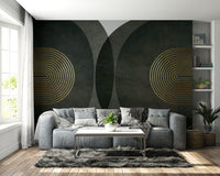 Modern Mid Century Charcoal Gold wallpaper mural with gold arches behind a grey leather sofa and shag rug in a living room