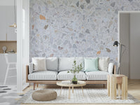 Pale marble-style wallpaper with fine dusty fragments.