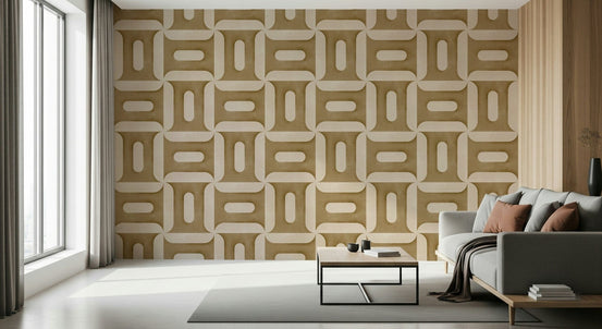 Modern Textured Geometries Camel wallpaper behind a grey sofa with rust cushions in a sunlit living room