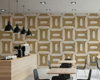 Modern Textured Geometries Camel wallpaper in a cafe with an espresso counter and black pendant lamps