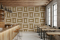 Modern Textured Geometries Camel wallpaper in a bar with a wood counter, stools and brick side wall