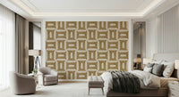 Modern Textured Geometries Camel wallpaper behind an upholstered bed and two cream armchairs in a bedroom