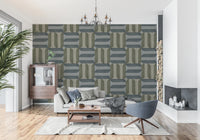 Modern Textured Signs Winter wallpaper in sage and grey geometric shapes behind a grey sofa and blue swivel chair in a living room