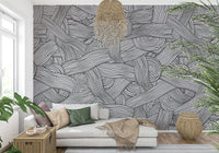 Monochromatic Striped Maze wall mural in black and white behind a white chaise sofa in a living room