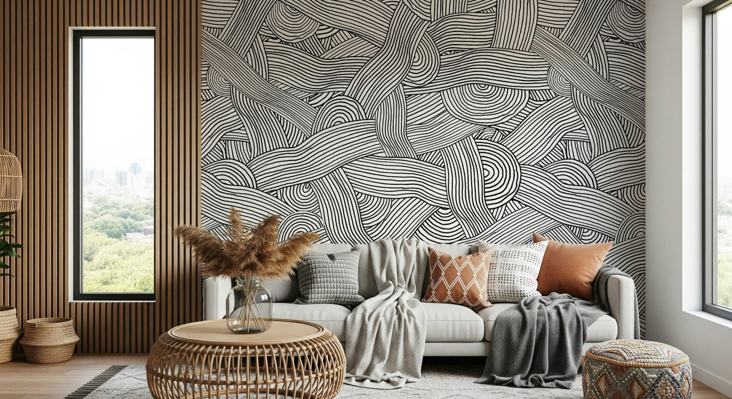 Monochromatic Striped Maze wall mural of swirling lines behind a grey sofa by a wood slat wall