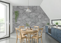 Monochromatic Striped Maze wall mural in black and white behind a wood table in a kitchen dining nook