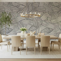 Monochromatic Striped Maze wall mural in black and white behind a long dining table in a dining room