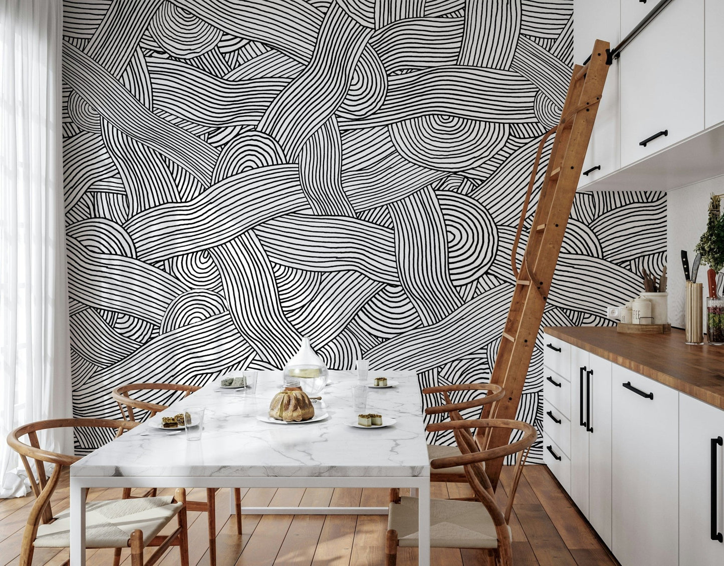 Monochromatic Striped Maze wall mural of swirling lines behind a marble table in a bright kitchen