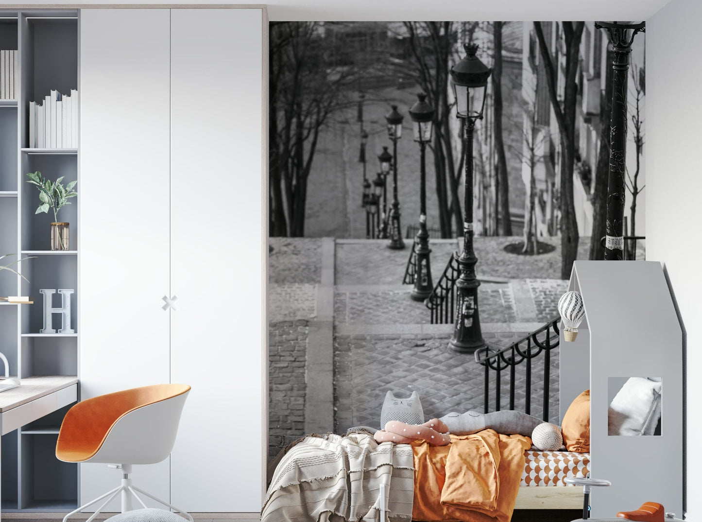 Elegant Montmartre street mural featuring cobblestone and lamps.

