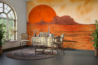 Monument Valley Sunset Mural Wallpaper in a minimalist study with industrial lighting.