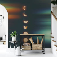 The mural has a dark background with light moons.

