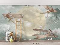 Moonlight Airplanes wallpaper mural styled as a feature wall behind a dining table and chairs in turquoise tones