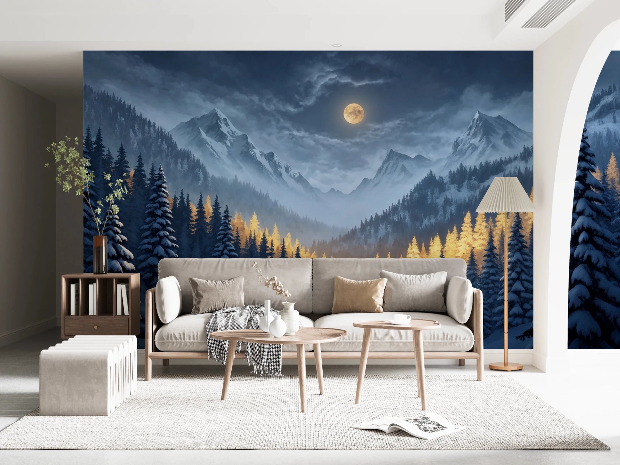 Moonlit Winterscape wallpaper mural of a golden moon over snowy mountains above a cream sofa in a living room