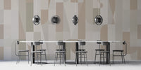 Mosaic Sepia Tones wallpaper of taupe and cream shapes in a dining room with a marble table and disc pendant lights
