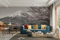 Black-and-white mural with pink cherry blossom highlights

