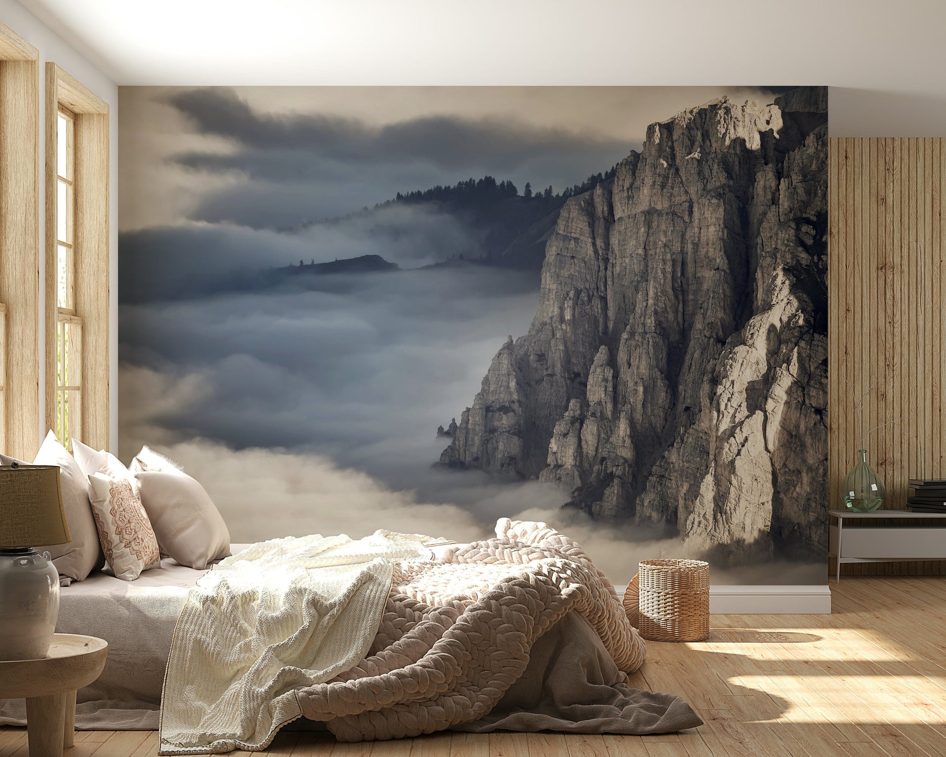 Mountain Majesty wallpaper mural of grey peaks in mist behind a low bed with cream knit throw in a bedroom