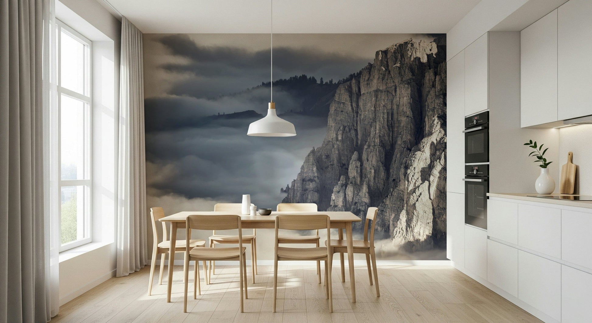 Mountain Majesty wallpaper mural of foggy cliffs behind a wood dining table in a bright white kitchen