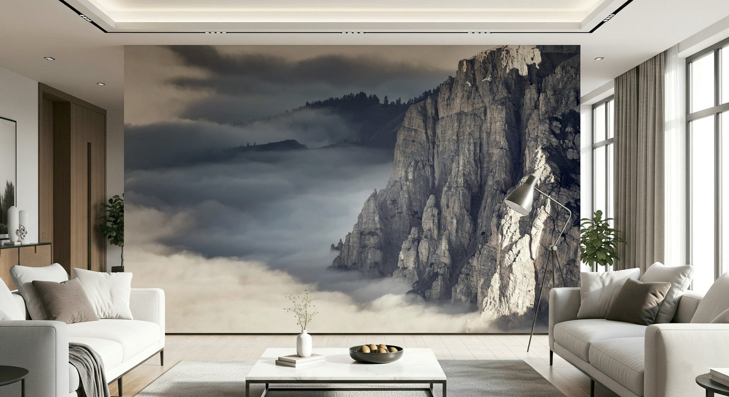 Mountain Majesty wallpaper mural of fog-filled peaks behind white sofas and a marble table in a living room