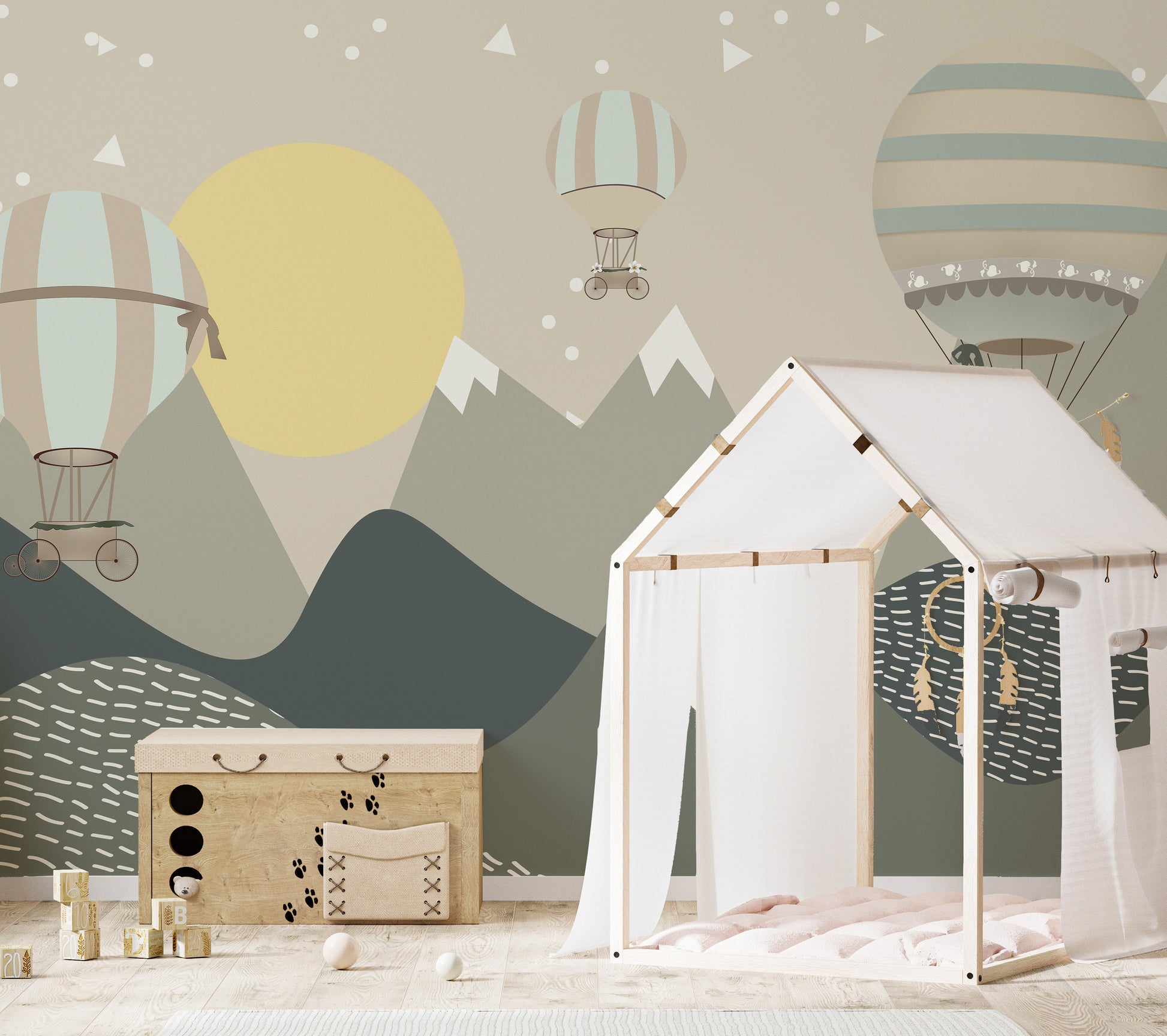 Mountains and Hot Air Balloons wallpaper in green with a yellow sun behind a wood house play tent and toy chest