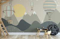 Mountains and Hot Air Balloons wallpaper in green and beige behind a loft ladder and Cool Kids chalkboard in a playroom