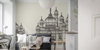 Mughal Palace wallpaper mural in grey behind a dark grey sofa and paper lantern in a living room