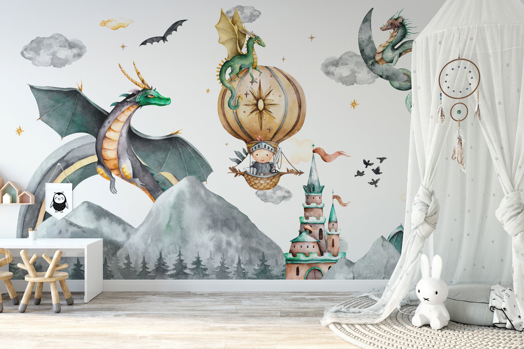 Mystical Mountain Dragon wallpaper with green dragons, a hot-air balloon and castle over grey peaks in a kids room