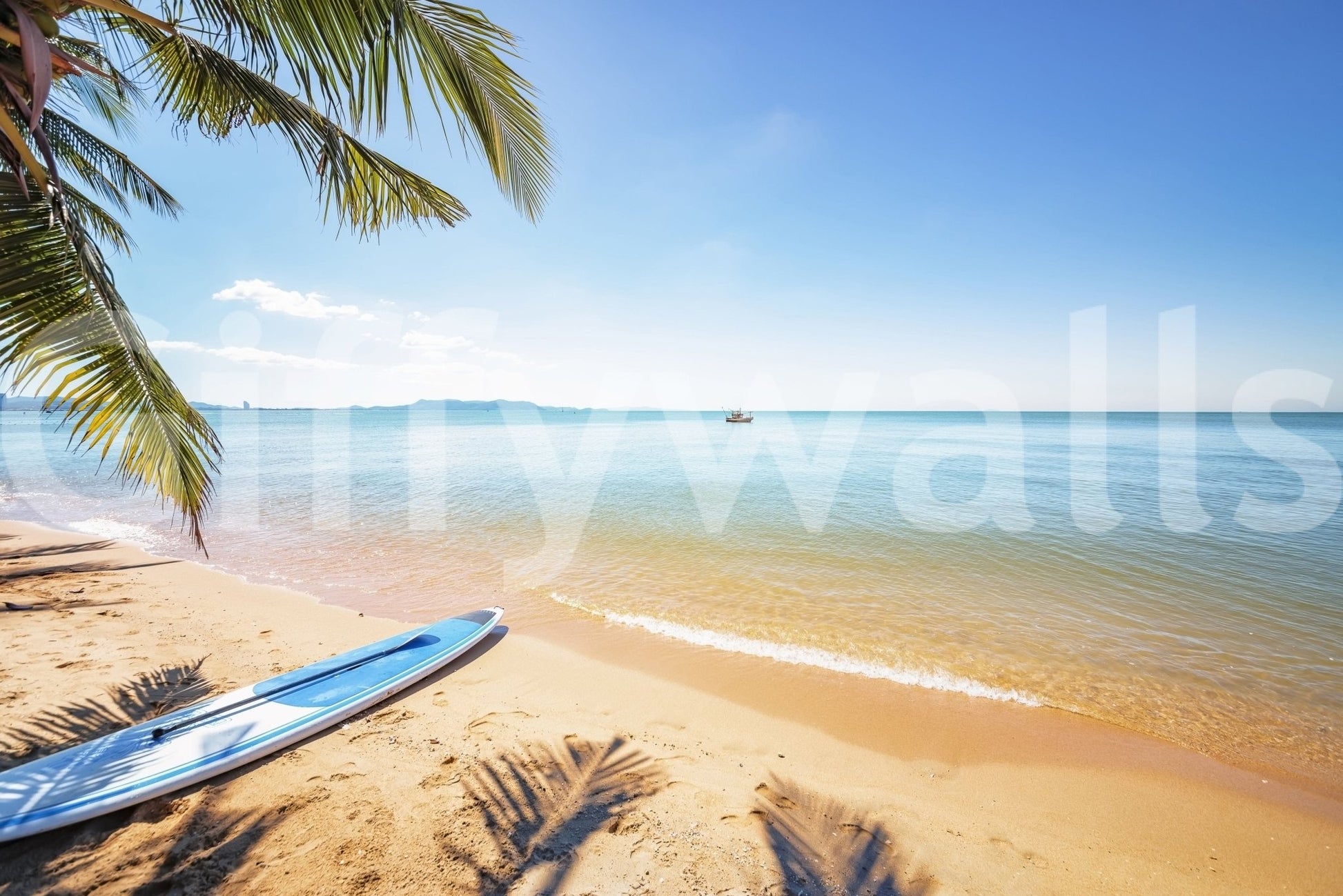 Na Jomtien wallpaper mural close-up of a blue paddleboard on golden sand under palm fronds beside a calm sea