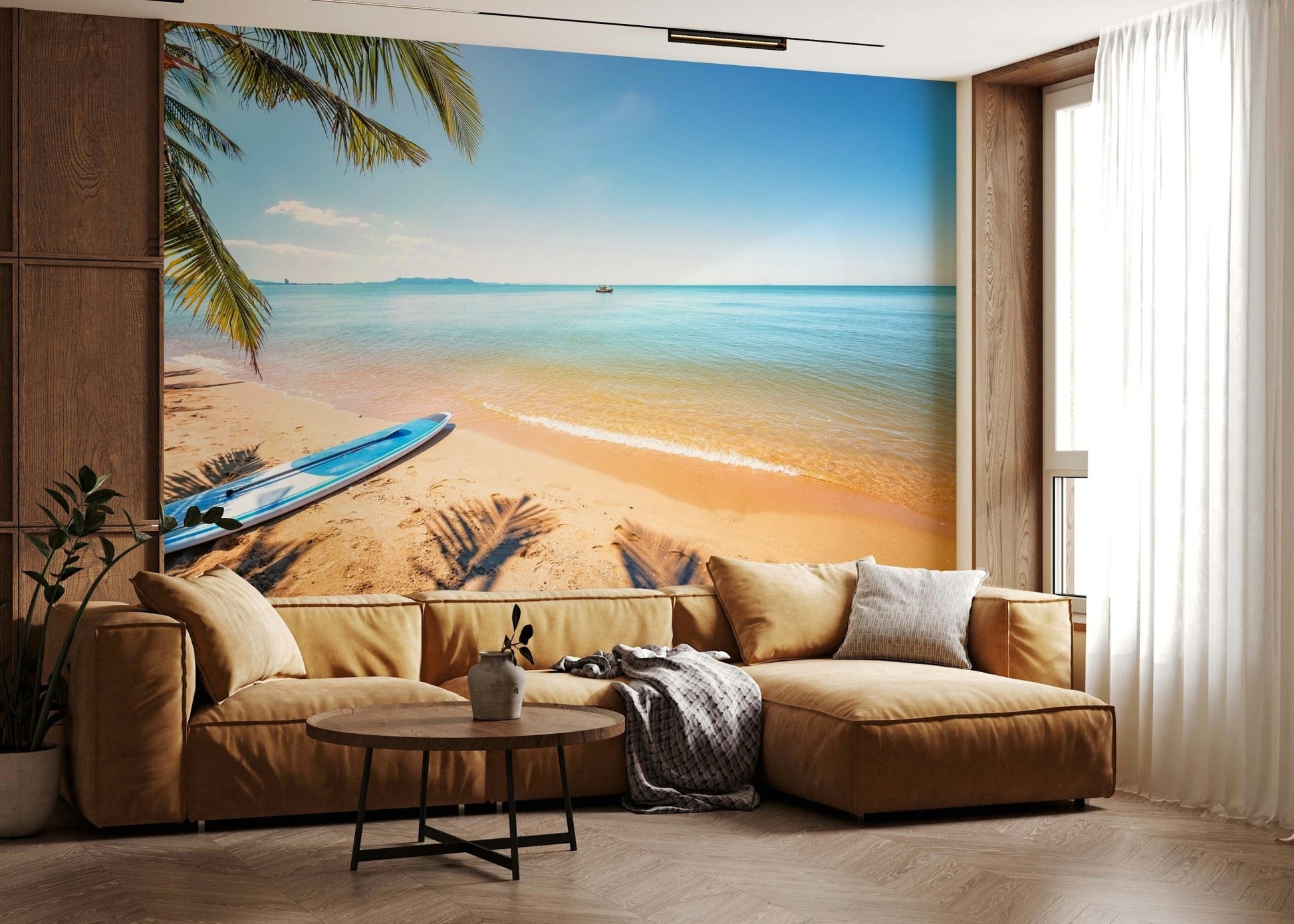Na Jomtien wallpaper mural of a palm-fringed beach behind a tan leather sectional in a warm living room