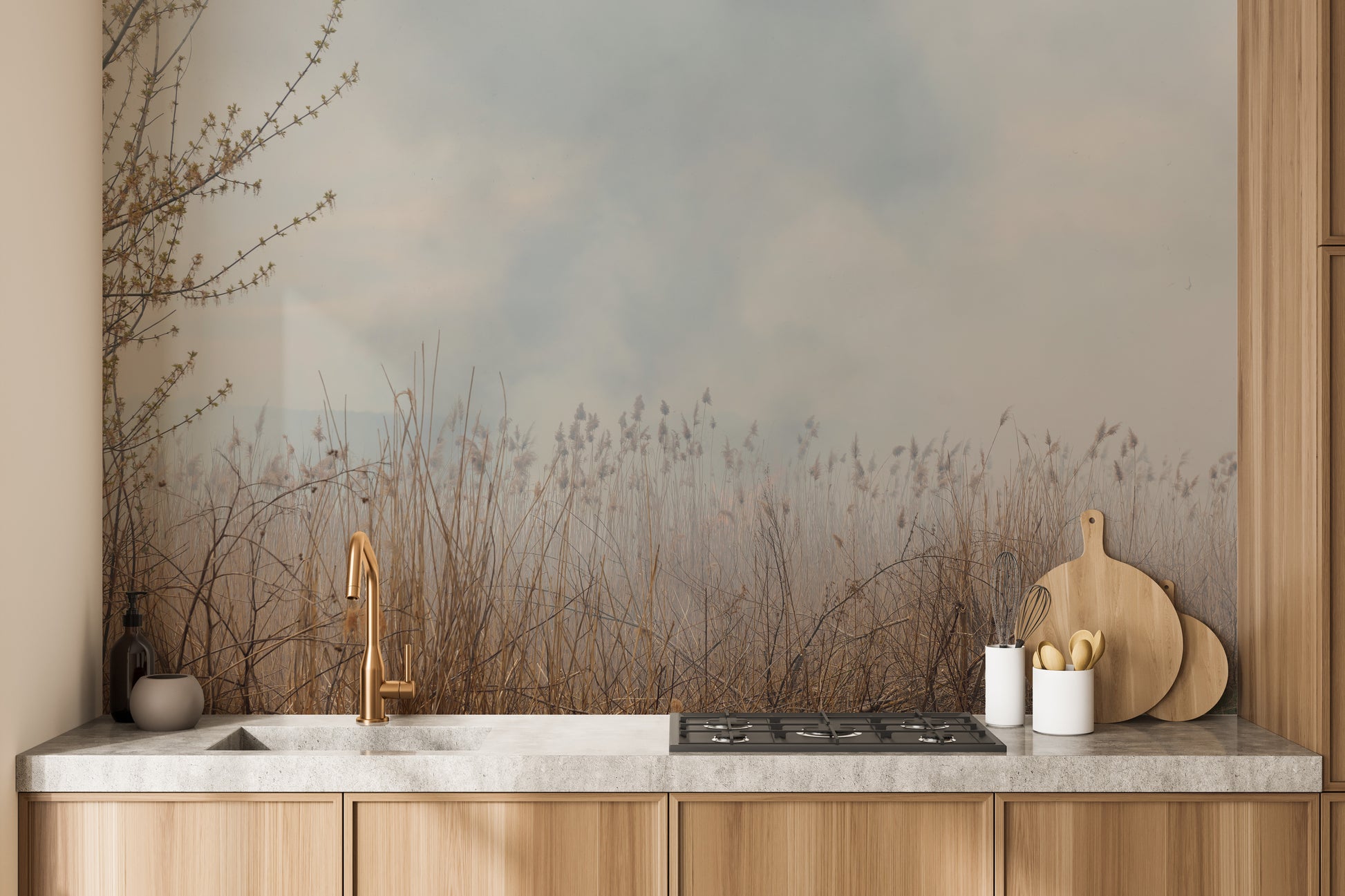 Natural Reeds wallpaper mural in beige and gray above wood cabinets and a stone counter in a kitchen