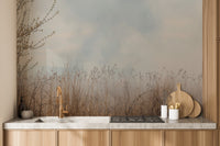 Natural Reeds wallpaper mural in beige and gray above wood cabinets and a stone counter in a kitchen
