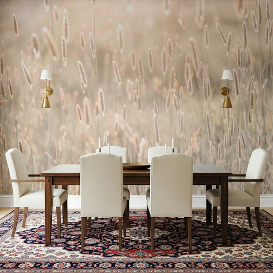 Nature's Bliss wallpaper mural of soft beige grasses behind a dark wood dining table and cream chairs in a dining room