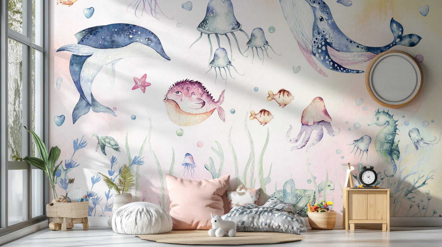 Nautical Creatures wall mural with dolphin and jellyfish above floor cushions and a wood nightstand in a kids room