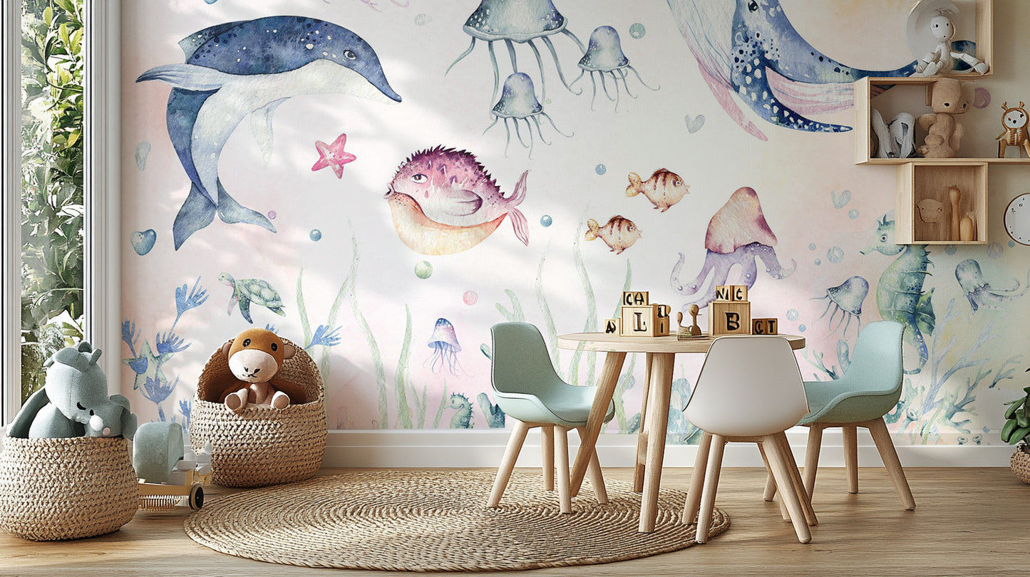 Nautical Creatures wall mural behind a round play table with teal kids chairs and wood blocks on a jute rug
