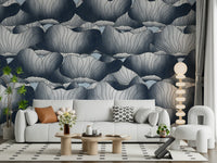 Navy Blue Botanical Bloom Waves wallpaper of inky lotus blooms behind a white sofa with a beaded floor lamp