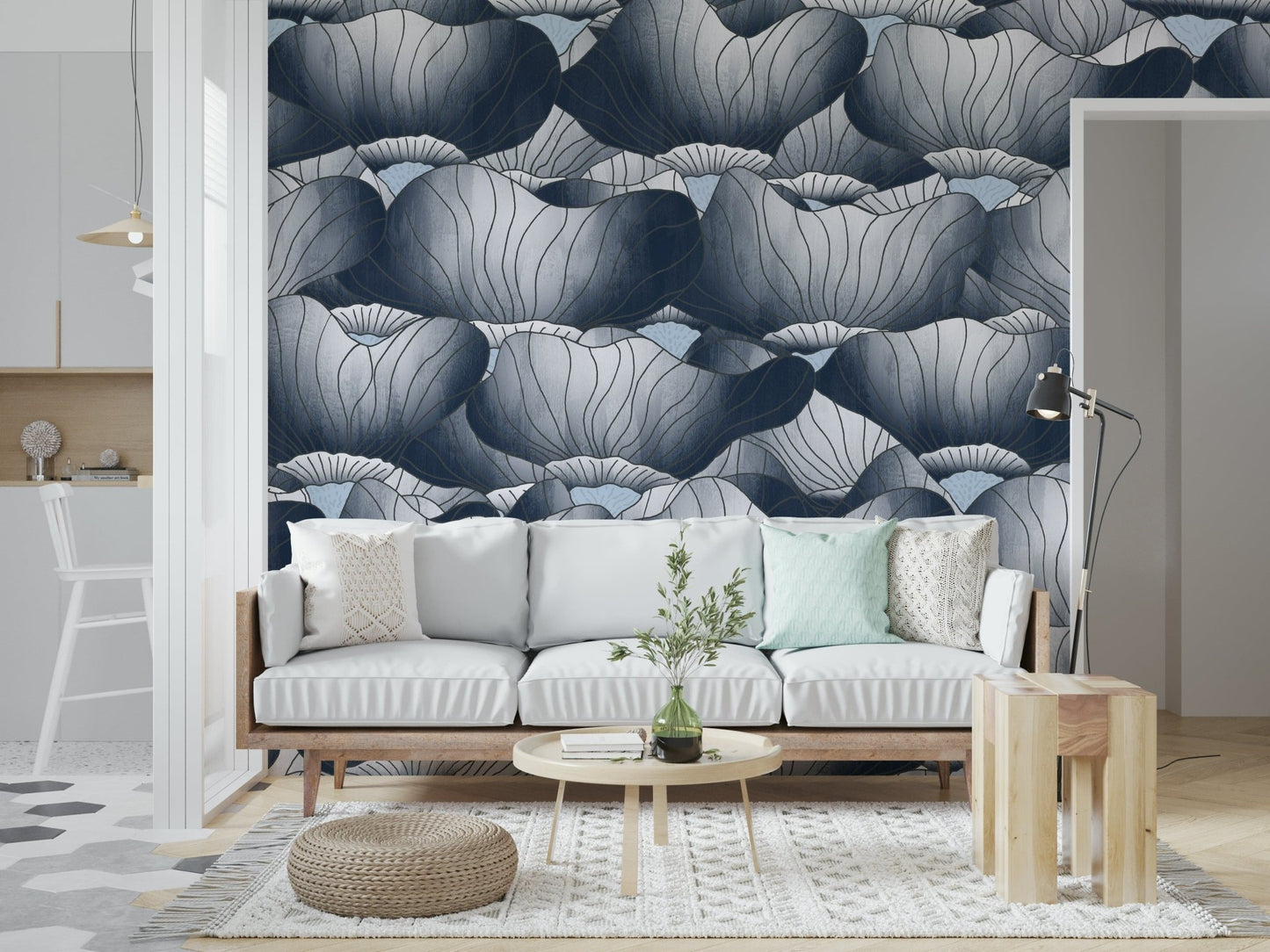Navy Blue Botanical Bloom Waves wallpaper behind a white sofa with a round wood coffee table and woven pouf on a jute rug