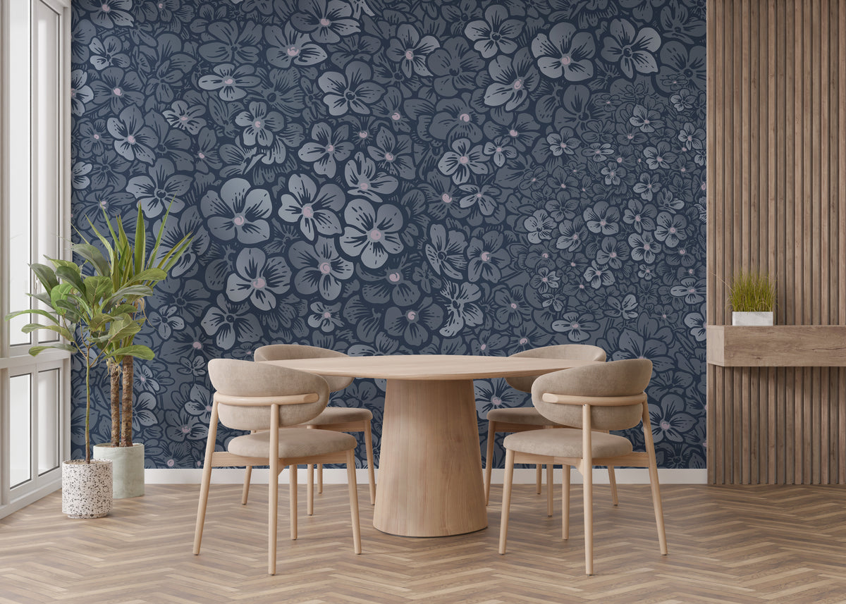 Navy Blue Garden Flower wallpaper mural behind a round wood table and beige chairs in a dining room