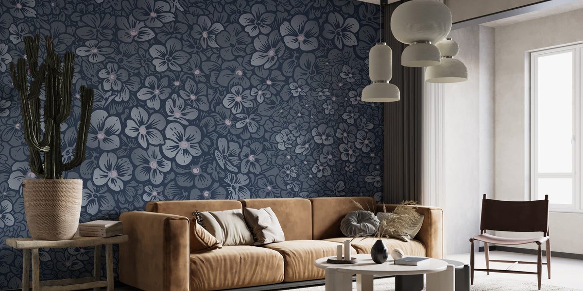 Navy Blue Garden Flower wallpaper mural behind a tan suede sofa and tall cactus in a living room