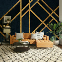 An artistic gold metallic mural on luxury wallpaper.


