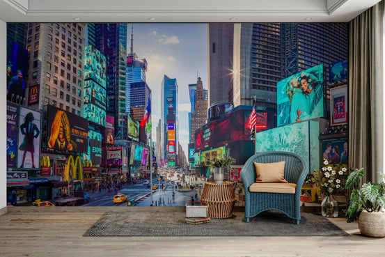 Neon Symphony wallpaper mural of Times Square neon billboards and taxis behind a blue armchair in a living room