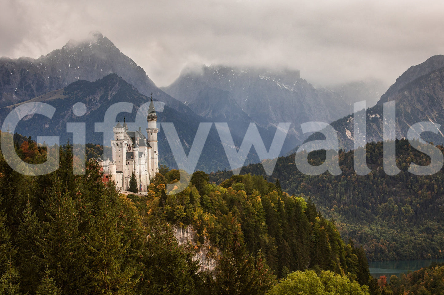Fairytale Castle View wallpaper mural shown as a full-wall mural of a white hilltop castle among autumn forest against misty mountain peaks