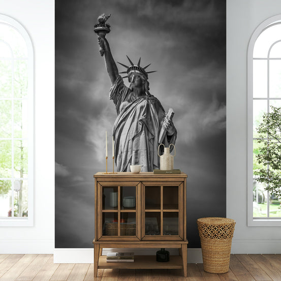 Large mural of the Statue of Liberty towering over NYC

