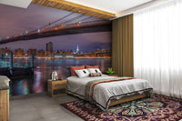 The image shows a full wall with glowing buildings and city lights.

