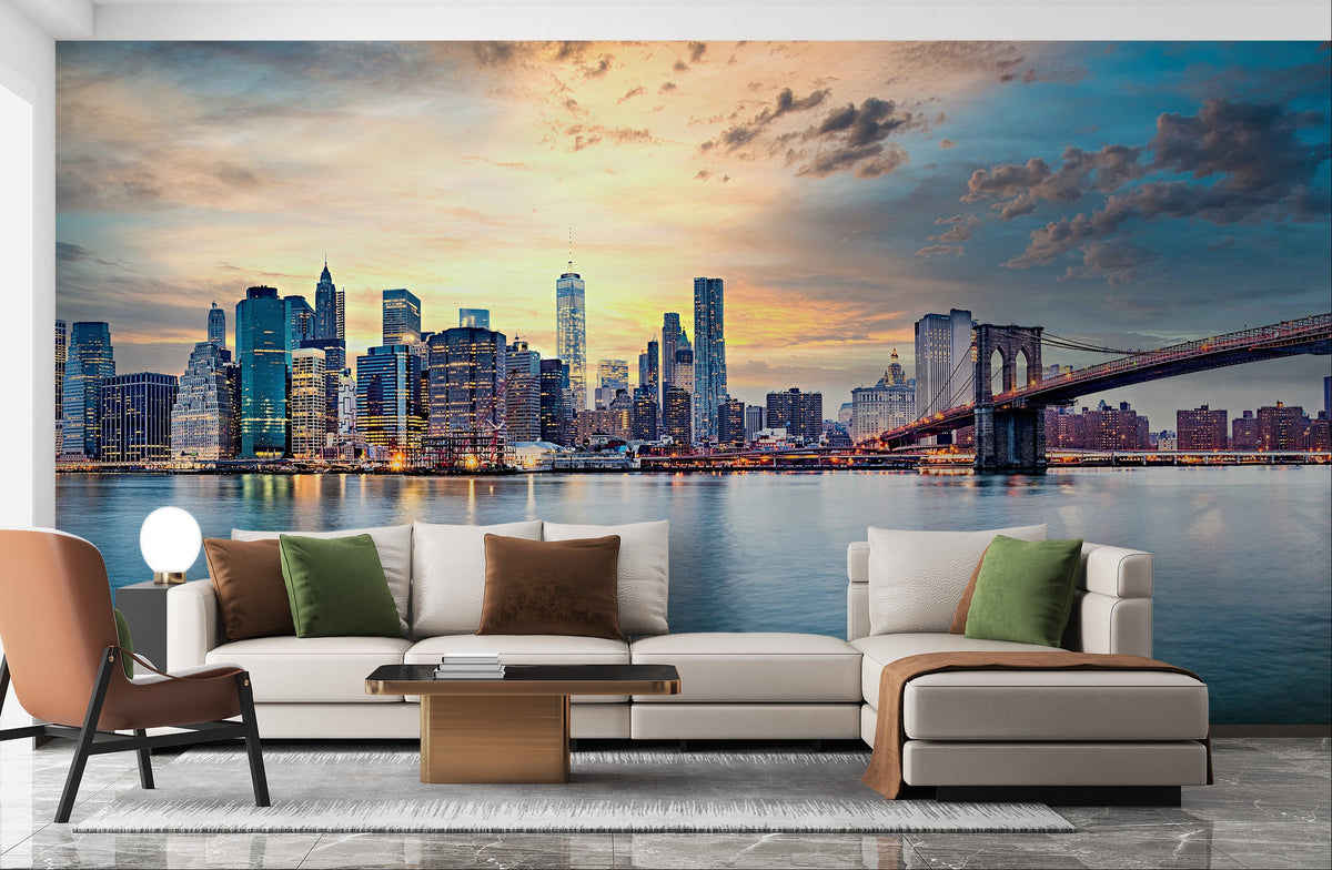 New York Sunset Panorama wallpaper mural with the Manhattan skyline and Brooklyn Bridge behind a cream sectional sofa