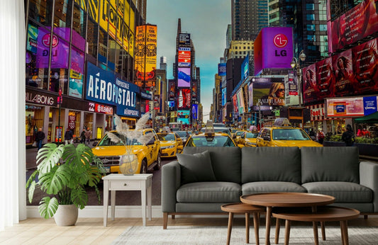 New York's Urban Pulse mural of yellow cabs in Times Square behind a grey sofa and monstera plant