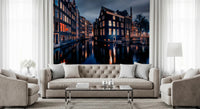 Night canal wall mural above modern beige sofa