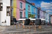 Vibrant yellow, pink, blue, and purple buildings.

