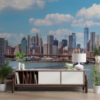 NYC Bridge Vista wallpaper mural of the sunny city skyline above a wooden sideboard in an entryway