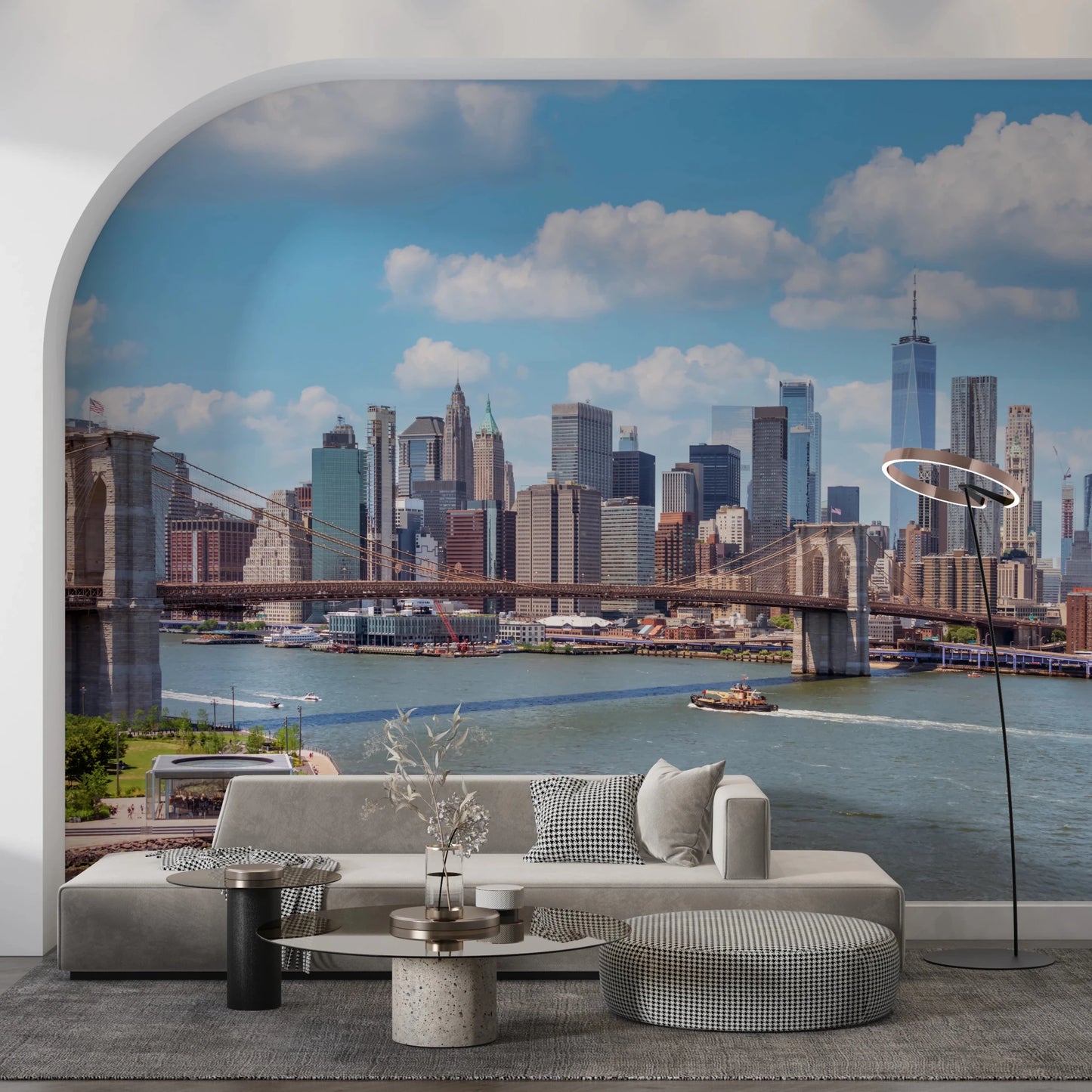 NYC Bridge Vista wallpaper mural of the bridge and skyline framed by an arched wall above a beige sofa