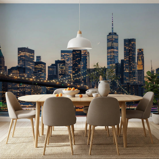 NYC Skyline at Twilight wallpaper mural of Manhattan and the Brooklyn Bridge behind a wood oval dining table and chairs